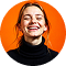 Joyful Woman Against Orange Background 1